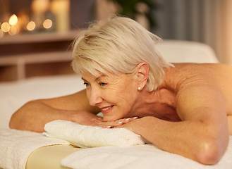 Image showing Happy woman, senior and relax on spa table for skincare treatment, holistic physical therapy and healing at beauty salon. Face of customer at luxury wellness resort for massage, holiday or calm detox