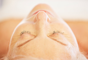 Image showing Relax, sleeping and senior woman at a spa for health, wellness and anti aging skincare treatment. Calm, beauty and closeup of elderly female person with wrinkles face routine at a natural salon.