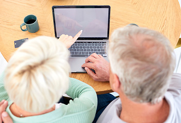 Image showing Laptop, top view and senior couple at table for online shopping, reading email and point at mockup space on screen. Computer, above and elderly people on desk for payment, search or banking in home