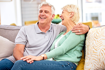 Image showing Funny, laughing or happy senior couple with love, care or joy together on sofa at home in retirement. Relax, silly joke or mature people hug with support, humor or loyalty on house living room couch