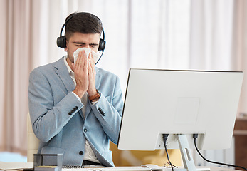 Image showing Consultant, sick or man blowing nose in call center telecom office with hay fever sneezing or illness. Cold, contact us or sales agent with toilet paper tissue, allergy virus or flu disease at work