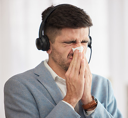 Image showing Customer service, sick or man blowing nose in call center office with hay fever sneezing or illness. Cold, contact us or sales agent with toilet paper tissue, allergy virus or flu disease at work