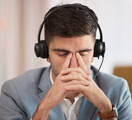 Image showing Employee, telemarketing and man with a headache, burnout and tech support with call center with crm. Person, consultant and insurance agent with a migraine, pc and tension with stress and fatigue