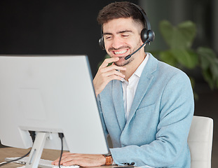 Image showing Man, headset and smile while looking at screen in office, talking and customer care for telemarketing. Person, consultant or operator with technology for business, e commerce or management of clients