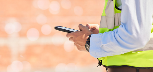 Image showing Hands of engineer on construction site, typing on phone and checking email for building schedule with mockup. Architecture, communication and business man with cellphone reading text, chat or report.