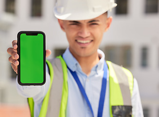 Image showing Engineering man, phone green screen and outdoor for contact information of architecture, renovation or design. Portrait, construction worker or builder and mobile app mockup or industrial advertising
