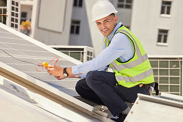 Image showing Portrait, engineer and man with solar panel, clean energy and construction with a hard hat, industry or smile. Worker, employee or technician with installation, innovation or sustainability on a roof