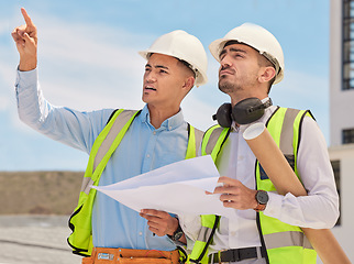 Image showing Industrial, blueprint and team of construction workers in the city planning maintenance or repairs on rooftop. Engineering, discussion and men industry employees in collaboration working on building.