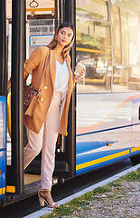 Image showing Business, woman or coffee at bus stop for travel or location with public transport for commute in urban city. Professional, corporate or person with beverage and sidewalk or street for transportation