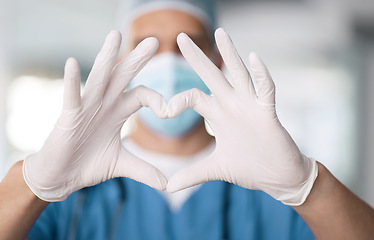 Image showing Male doctor, hands and heart in closeup with thank you for support and trust with healthcare. Medical professional, love and care or hope, help and zoom in emoji for gratitude by blurred background