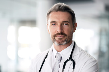 Image showing Mature doctor, portrait and man in hospital for healthcare, wellness and career in clinic. Face, medical professional and confident expert surgeon, therapist worker and senior employee in Canada.