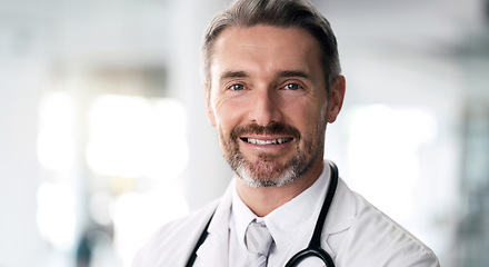 Image showing Mature doctor, portrait and happy man in hospital for healthcare, wellness and career in clinic. Face, medical professional smile and confident expert surgeon, therapist worker and employee in Canada