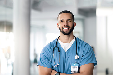 Image showing Smile, nurse and portrait of man with arms crossed in hospital for healthcare, wellness or nursing. Face of happy surgeon, confident medical professional and employee, worker and expert in Brazil