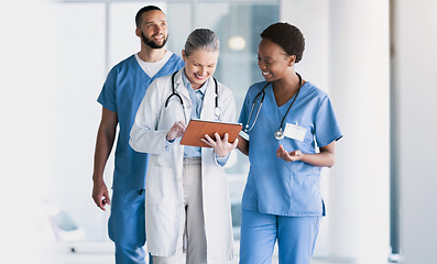 Image showing Doctor, team and tablet in research, schedule planning or online search together at hospital. Group of happy medical or healthcare employees with technology in teamwork for surgery plan at clinic