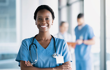 Image showing Smile, nurse and portrait of black woman with arms crossed in hospital for healthcare, wellness and nursing career. Face of happy African surgeon, confident medical professional worker and employee