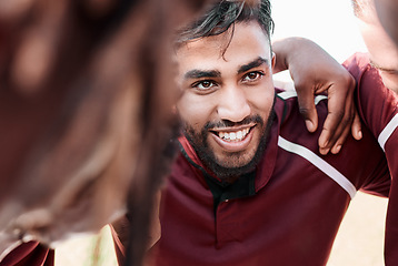 Image showing Sports, huddle and rugby team on a field planning a strategy for a game, match or tournament. Fitness, diversity and man captain talking to group at training, exercise or practice on an outdoor pitch