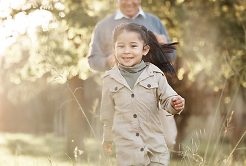 Image showing Running, nature and portrait of a child with grandfather for bonding, playing and love in a park. Smile, family and a girl kid with a senior man in a field for playful energy, freedom and care