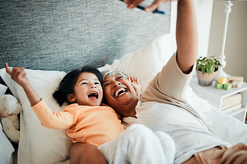 Image showing Selfie, grandmother and relax child on bed bonding, excited and love for happy family with care. Photography, technology and senior woman with little girl in bedroom on video call together in home.