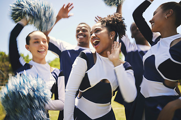 Image showing Cheerleaders, outdoor and team for celebration, smile and winner with happiness, excited and teamwork. Women, men and group cheering, grass field or chanting for champion, support and motivation