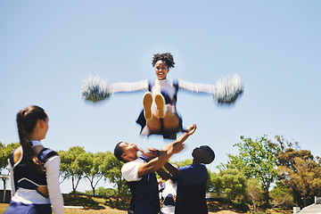 Image showing Teamwork, air or cheerleader training in fitness workout, exercise or learning a jump routine on field. Catch, dance or sports woman in group for motivation, inspiration or support on college campus