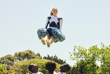 Image showing Sports, portrait and woman cheerleader in air on a field for motivation or support practice with team. Fitness, cheerleading and female athlete training for skill and dance with blur at competition.