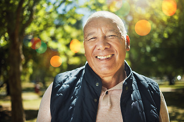 Image showing Happy, portrait and senior man with bokeh in a park, forest or woods with freedom, good mood or positive mindset. Smile, face and elderly male person enjoy retirement in nature with morning fresh air