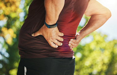 Image showing Mature man, workout and back pain with sweat, injury and hands for stretching, muscle ache and inflammation. Outdoor, run and fitness for health, wellness or exercise in sportswear, break or accident