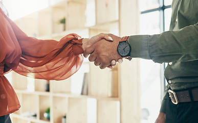 Image showing Creative people, handshake and partnership in meeting, b2b deal or teamwork together at office. Closeup of man and woman shaking hands for startup, introduction or thank you in agreement at workplace