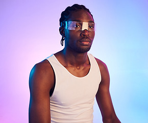 Image showing Man, virtual reality or futuristic sunglasses for fashion, designer brand and style in studio on neon background. Young african person in trendy vaporwave and technology, vision or metaverse glasses