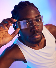 Image showing Man, portrait and virtual reality sunglasses for futuristic fashion, designer brand and style in studio on neon background. Face of african person in trendy tech, VR vision and glasses in vaporwave