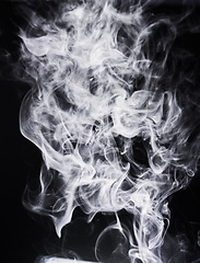 Image showing Smoke, incense or gas in a studio with dark background by mockup space for magic effect with abstract. Fog, steam or vapor mist moving in air for cloud smog pattern by black backdrop with mock up.