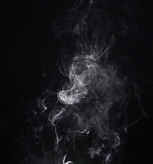 Image showing White smoke, creative and art on black background, fog and pattern in vapor, mist and incense. Fumes, smog and steam or air, gas and dry ice effect in abstract, artistic and pollution with mystery