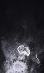 Image showing Smoke, black background and steam, fog or gas on mockup space wallpaper. Cloud, smog and magic effect on dark backdrop of mist with abstract texture, pollution pattern or incense vapor moving in air