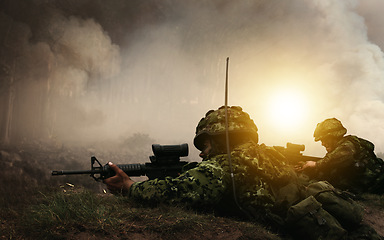 Image showing Military, war and soldier by smoke for target, battlefield or fight in forest with army uniform, guns and protection. Warzone, warrior and person in camp look at apocalypse in woods for defence duty