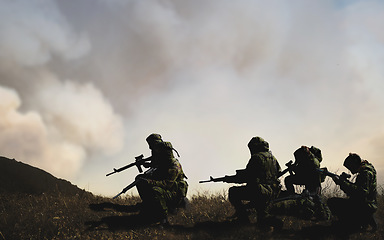 Image showing Military, war and soldier by smoke for service, battlefield or fight in forest with army uniform, guns and protection. Warzone, warrior and people in camp look at apocalypse in woods for defence duty