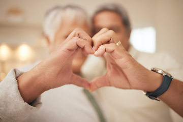 Image showing Heart hands, emoji and senior couple in home with commitment, support and marriage in retirement together. Love sign, happy man and old woman in apartment with icon for romantic gesture of loyalty.