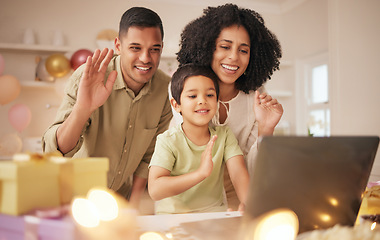 Image showing Video call, laptop and family with birthday celebration in a kitchen happy, excited and love in their home. Virtual, party and hello by parents with child online with cake, gift or waving gesture