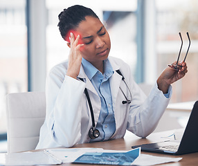 Image showing Woman, doctor or headache at desk or medicine burnout at hospital, mental health stress or tired. African female professional, fatigue or pain and working with brain fog depression, vertigo or sick
