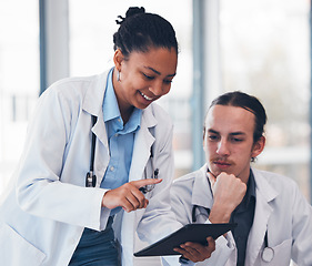 Image showing People, doctor and mentor with tablet in hospital for consultation, teaching or training. Diverse team, man and woman in medical care in health, strategy or results for patient, diagnosis and clinic