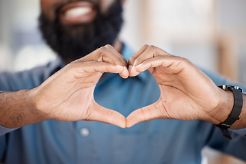 Image showing Man, hands and heart with gesture in closeup, alone and blurred background. African, person or model with love, hope or support for community in solidarity with human rights, social justice or change