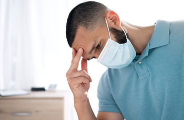 Image showing Stress, headache and sad man in face mask, sick and tired of financial crisis in home. Fail challenge, anxiety and person with fatigue, burnout and thinking of bankruptcy, debt mistake and depression