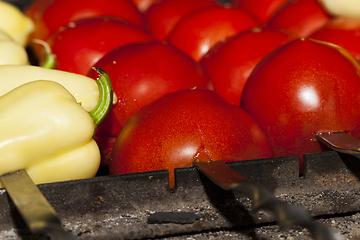 Image showing peppers on the coals