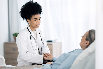 Image showing Hospital, doctor and senior patient with care, comfort and empathy for diagnosis news in bed. Healthcare, clinic and health worker with woman holding hands for support, wellness and medical results