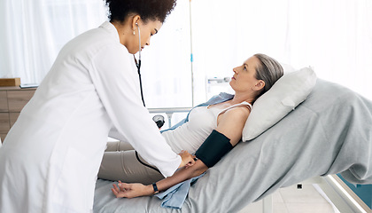 Image showing Patient consultation, women and nurse hypertension test for hospital exam, client wellness or surgeon nursing service. Anatomy check, medical help or doctor monitor blood pressure, pulse or diabetes