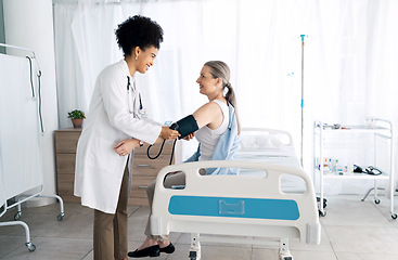 Image showing Clinic patient, happy people and doctor hypertension test for medical exam, assessment or professional service. Medicine expert, sphygmomanometer and nurse monitor blood pressure, pulse or wellness