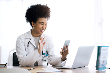 Image showing Doctor, woman and video call or phone communication in healthcare, social media or telehealth service at office. Happy african person or medical worker wave hello or talking on mobile voip for advice