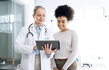 Image showing Woman doctor, medical results and tablet at hospital with patient discussion and surgery info. Wellness advice, technology and mature female professional with healthcare, consulting and talking