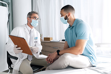 Image showing Doctor, men and tablet with face mask in healthcare consultation, patient history and test results or online advice. Medical professional on digital technology for clinic support for covid or virus