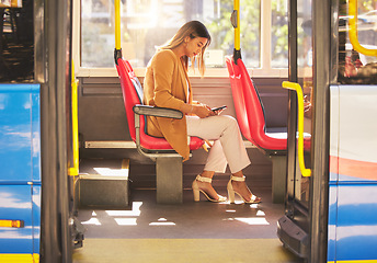 Image showing Woman in bus, sitting and typing on smartphone for social media, email and and travel on urban commute. Public transport, service and drive, girl with phone reading schedule or agenda on road to work