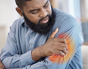 Image showing Black man, arm pain and remote work with injury, muscle problem and red inflammation at home. African male person, freelancer shoulder and joint damage with heart attack warning and stress in house